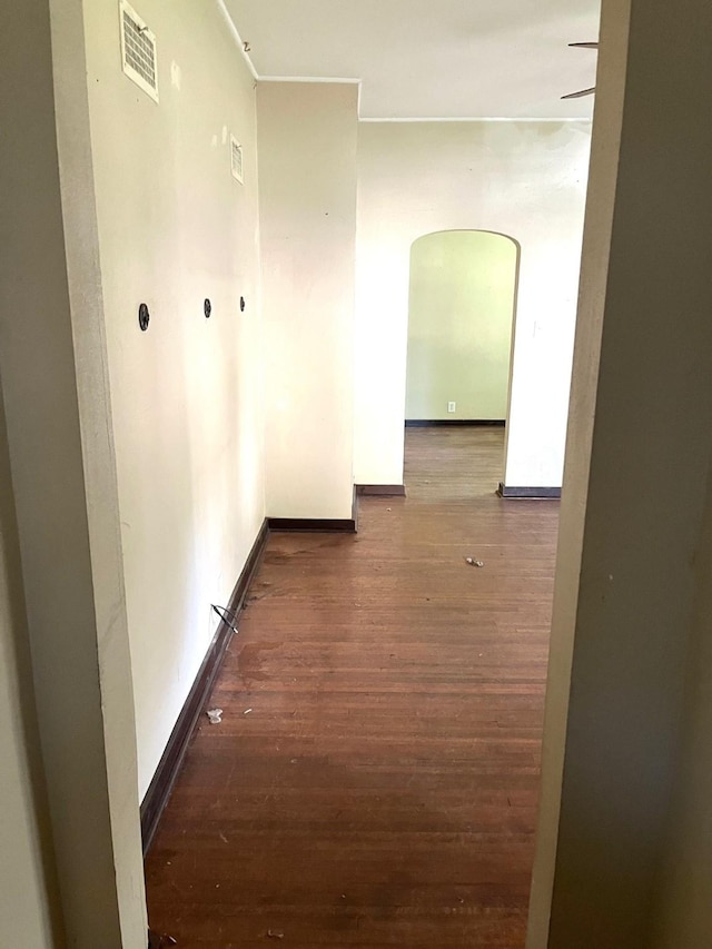 1216 Marshall St, Boone, IA 50036 - hall featuring arched walkways, wood finished floors, and baseboards