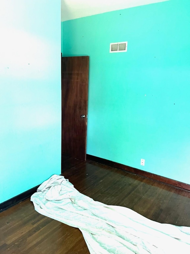 1216 Marshall St, Boone, IA 50036 - unfurnished bedroom with wood finished floors and baseboards