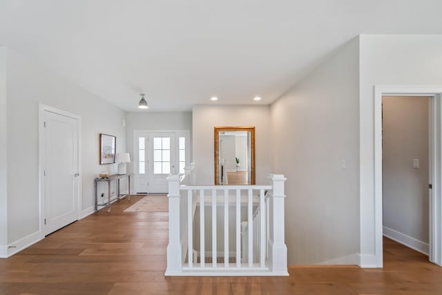 901 Cardinal Dr, Polk City, IA 50226 - hallway featuring an upstairs landing, wood finished floors, recessed lighting, and baseboards