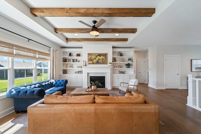901 Cardinal Dr, Polk City, IA 50226 - living room with wood finished floors, a ceiling fan, a fireplace, baseboards, and beamed ceiling