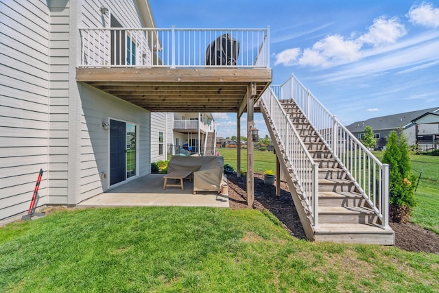 901 Cardinal Dr, Polk City, IA 50226 - view of grassy yard featuring stairway, a patio area, and a deck