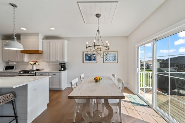 901 Cardinal Dr, Polk City, IA 50226 - dining space featuring light wood-style flooring, a chandelier, recessed lighting, and baseboards