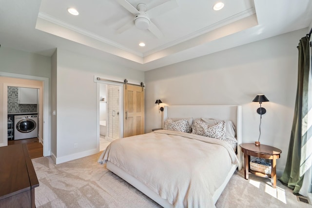 901 Cardinal Dr, Polk City, IA 50226 - bedroom with washer / clothes dryer, a barn door, a raised ceiling, ornamental molding, and recessed lighting