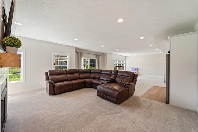 901 Cardinal Dr, Polk City, IA 50226 - living room featuring light colored carpet, recessed lighting, baseboards, and a textured ceiling