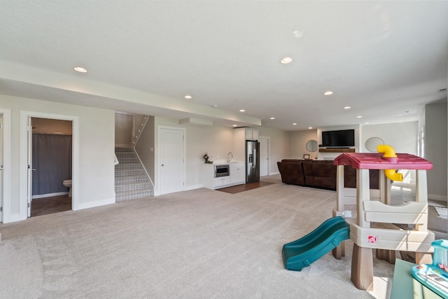 901 Cardinal Dr, Polk City, IA 50226 - game room with light colored carpet, recessed lighting, and baseboards