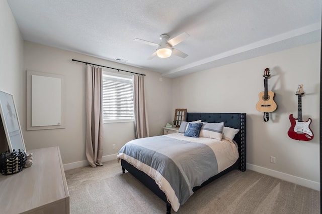 901 Cardinal Dr, Polk City, IA 50226 - bedroom with light carpet, baseboards, and ceiling fan