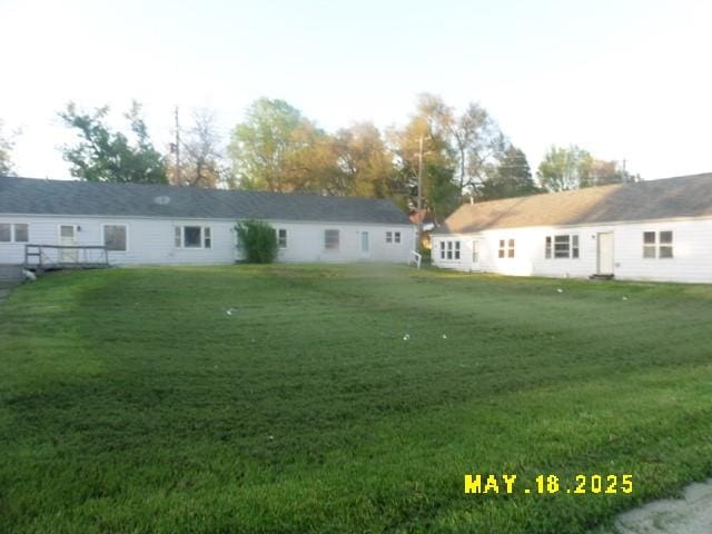 206 S D St, Indianola, IA 50125 - rear view of house featuring a yard