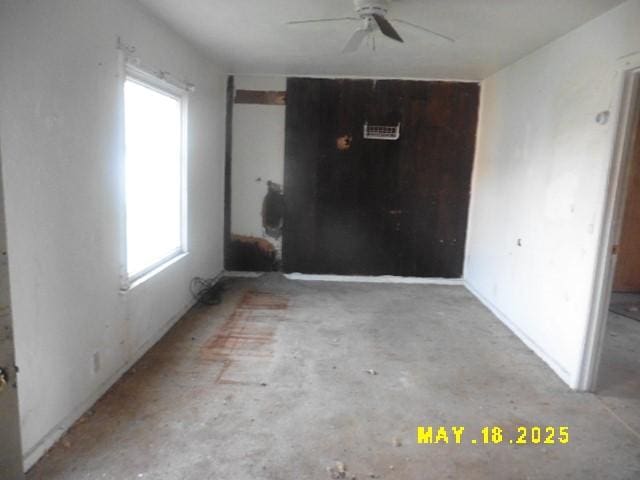 206 S D St, Indianola, IA 50125 - empty room featuring ceiling fan and concrete flooring