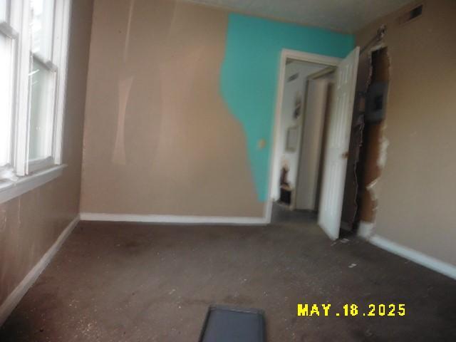 206 S D St, Indianola, IA 50125 - spare room featuring baseboards