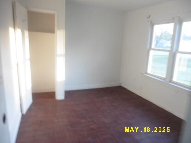 206 S D St, Indianola, IA 50125 - unfurnished bedroom featuring baseboards