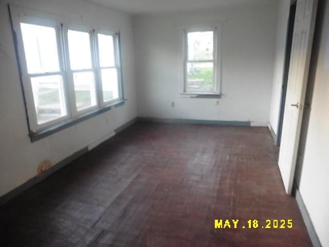 206 S D St, Indianola, IA 50125 - unfurnished room featuring baseboards and brick patterned flooring