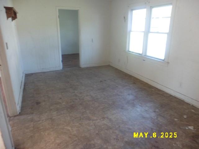 410 W 2nd Ave, Indianola, IA 50125 - unfurnished room with tile patterned floors and baseboards