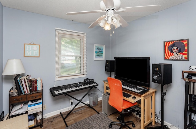 1309 Mccormick St, Des Moines, IA 50316 - office space featuring wood finished floors, a ceiling fan, and baseboards