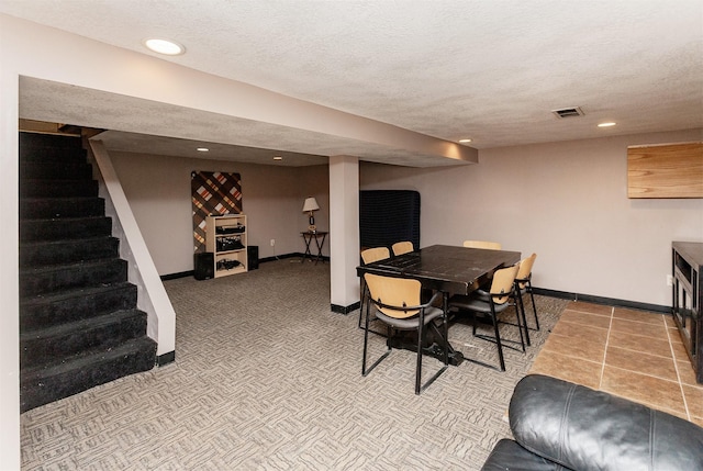 1309 Mccormick St, Des Moines, IA 50316 - carpeted dining area featuring baseboards, stairway, a textured ceiling, and recessed lighting
