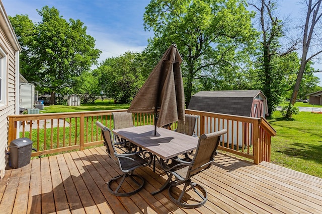 1309 Mccormick St, Des Moines, IA 50316 - wooden terrace with outdoor dining area and a lawn