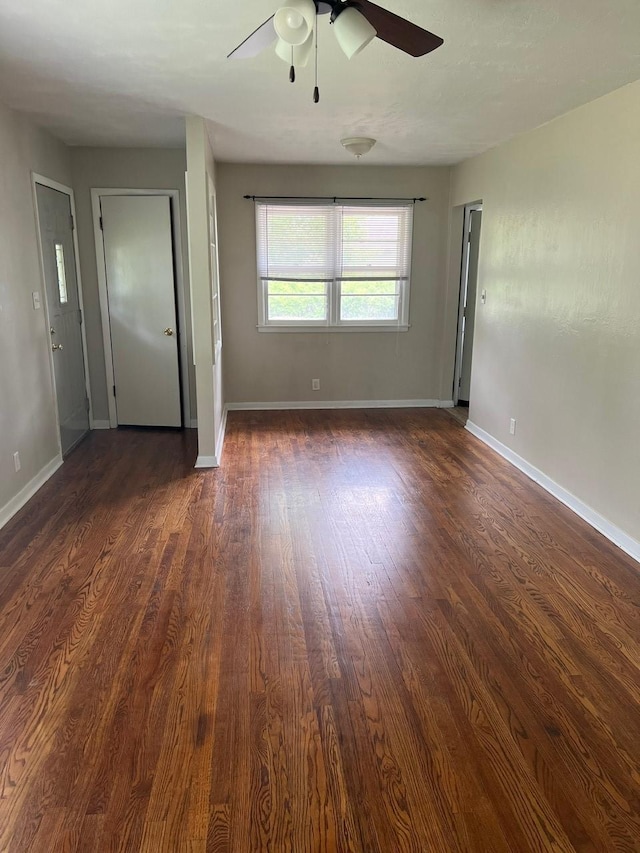 160 Bel Aire Dr, Waukee, IA 50263 - empty room featuring a ceiling fan, dark wood-style floors, and baseboards