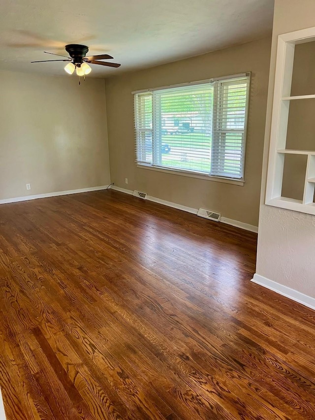 160 Bel Aire Dr, Waukee, IA 50263 - unfurnished room featuring wood finished floors, baseboards, and ceiling fan