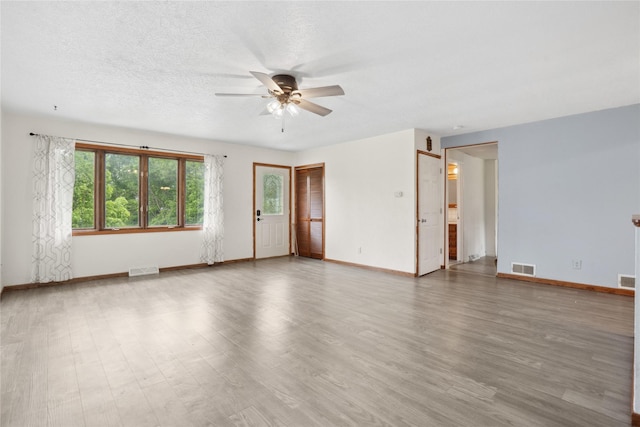 807 Center St, Grinnell, IA 50112 - unfurnished room featuring a ceiling fan and wood finished floors