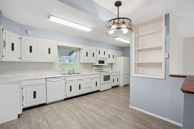 807 Center St, Grinnell, IA 50112 - kitchen with white appliances, open shelves, tasteful backsplash, and white cabinets