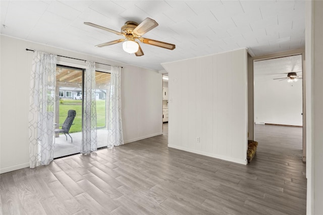 807 Center St, Grinnell, IA 50112 - empty room featuring ceiling fan and wood finished floors