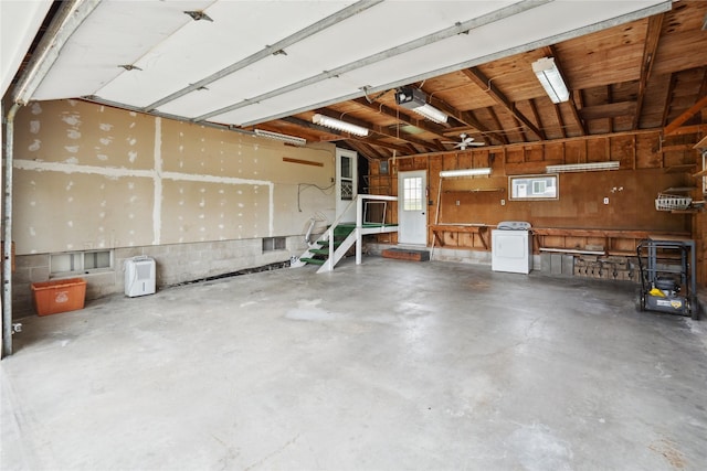 807 Center St, Grinnell, IA 50112 - garage with washer / dryer and a garage door opener