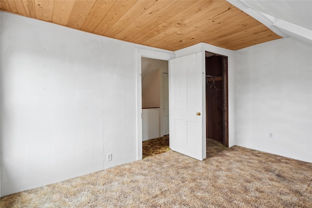 807 Center St, Grinnell, IA 50112 - unfurnished bedroom featuring wood ceiling and carpet flooring