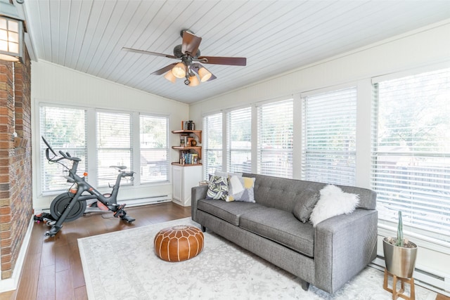 6704 Elmcrest Dr, Windsor Heights, IA 50324 - living area with baseboard heating, vaulted ceiling, ceiling fan, wood finished floors, and crown molding