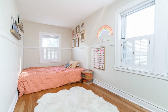 6704 Elmcrest Dr, Windsor Heights, IA 50324 - bedroom featuring wood finished floors and baseboards