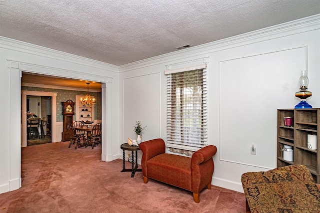 113 N Locust St, Madrid, IA 50156 - sitting room with a chandelier, crown molding, carpet flooring, a textured ceiling, and baseboards