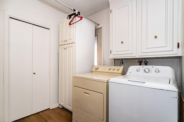 113 N Locust St, Madrid, IA 50156 - laundry area with cabinet space, washer and clothes dryer, wood finished floors, and a textured ceiling