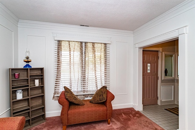 113 N Locust St, Madrid, IA 50156 - sitting room with crown molding, a textured ceiling, and carpet