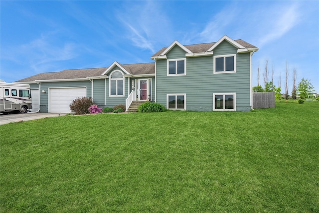 5545 E Douglas Ave, Des Moines, IA 50317 - split level home with an attached garage, a front lawn, concrete driveway, and roof with shingles