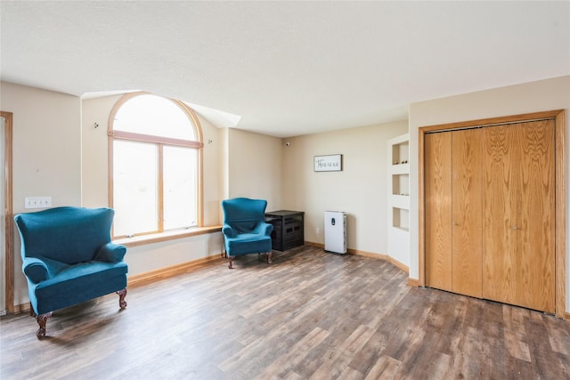 5545 E Douglas Ave, Des Moines, IA 50317 - sitting room featuring wood finished floors and baseboards