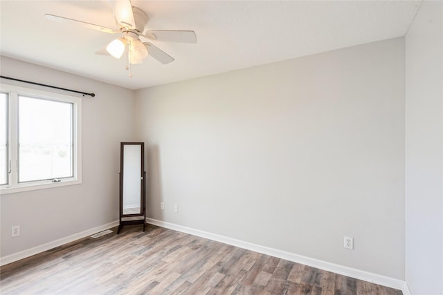 5545 E Douglas Ave, Des Moines, IA 50317 - empty room featuring light wood-style floors and baseboards