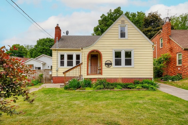 2004 40th St, Des Moines, IA 50310 - view of front of home with a chimney and a shingled roof