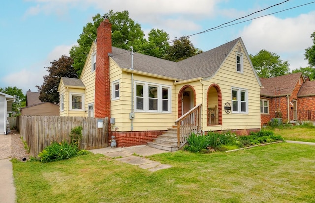 2004 40th St, Des Moines, IA 50310 - view of front of house featuring a chimney and a shingled roof