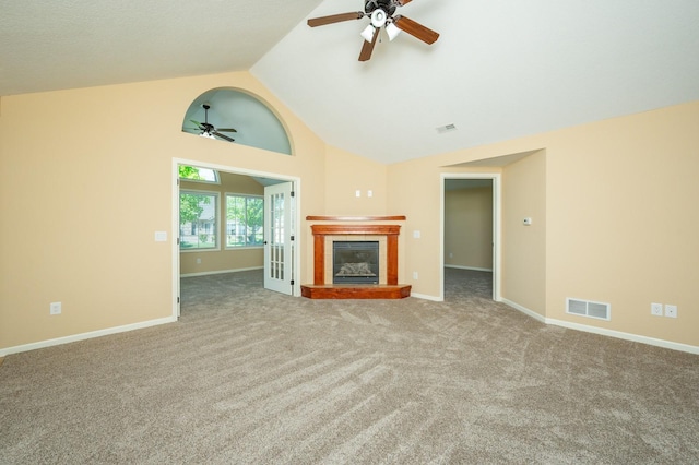 3305 SE Glenstone Dr Unit 236, Grimes, IA 50111 - unfurnished living room with ceiling fan, a glass covered fireplace, carpet, high vaulted ceiling, and baseboards