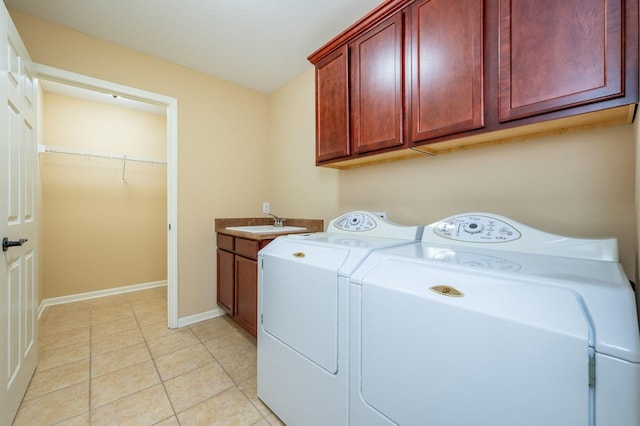 3305 SE Glenstone Dr Unit 236, Grimes, IA 50111 - washroom with cabinet space, washing machine and dryer, light tile patterned floors, and baseboards
