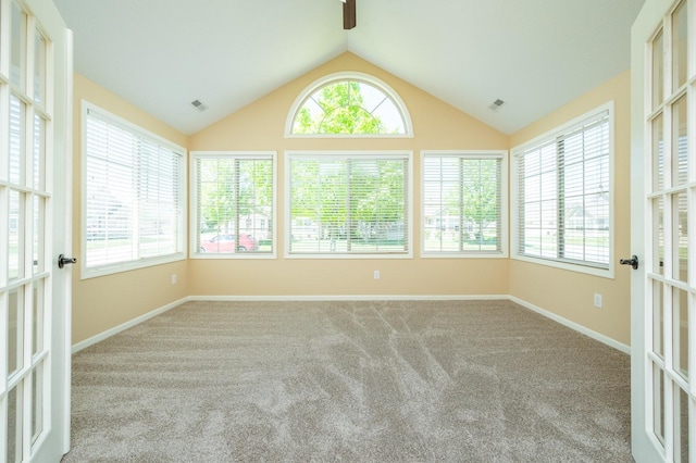3305 SE Glenstone Dr Unit 236, Grimes, IA 50111 - unfurnished sunroom with carpet floors, vaulted ceiling, baseboards, and french doors