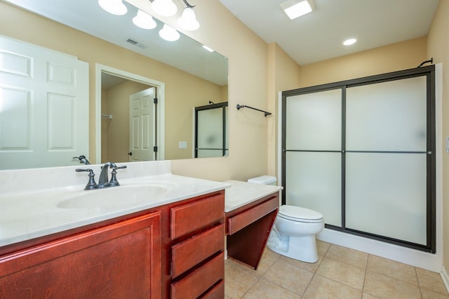 3305 SE Glenstone Dr Unit 236, Grimes, IA 50111 - bathroom with vanity, tile patterned floors, a shower stall, and toilet