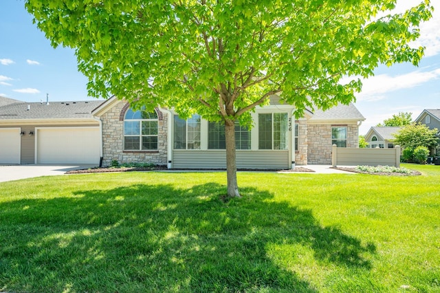 3305 SE Glenstone Dr Unit 236, Grimes, IA 50111 - obstructed view of property with stone siding, an attached garage, concrete driveway, a front lawn, and a shingled roof