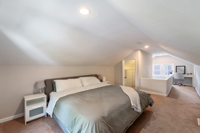 1516 57th Pl, Des Moines, IA 50311 - bedroom featuring light carpet, lofted ceiling, baseboards, and connected bathroom