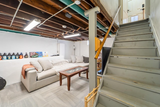 1516 57th Pl, Des Moines, IA 50311 - basement featuring stairway and carpet flooring
