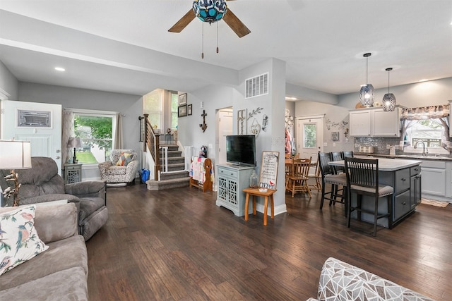 305 E State St, Baxter, IA 50028 - living room featuring a ceiling fan, dark wood-style flooring, stairway, and recessed lighting