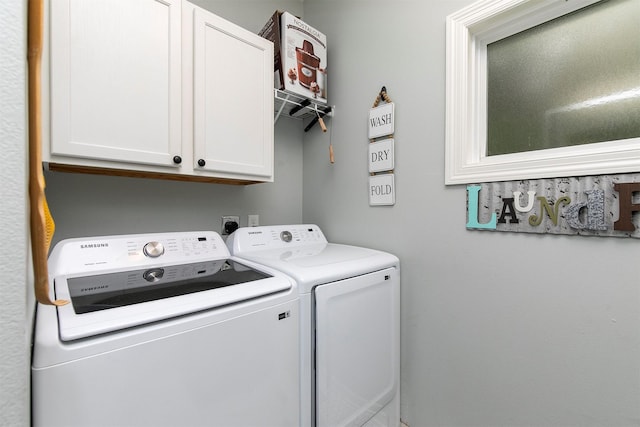 305 E State St, Baxter, IA 50028 - laundry area featuring washing machine and clothes dryer and cabinet space