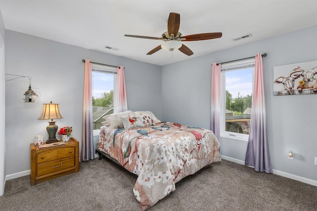 305 E State St, Baxter, IA 50028 - carpeted bedroom with a ceiling fan and baseboards