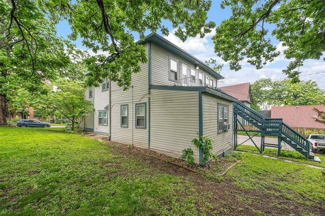 732 19th St, Des Moines, IA 50314 - view of property exterior featuring a lawn and stairs