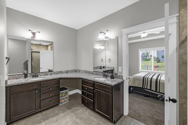 3911 NW 14th Ct, Ankeny, IA 50023 - ensuite bathroom featuring double vanity, a stall shower, and a ceiling fan