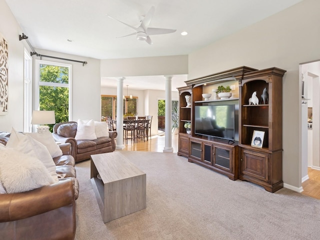 1702 Quail Cove Ct, West Des Moines, IA 50265 - living area featuring ornate columns, light carpet, ceiling fan, recessed lighting, and baseboards