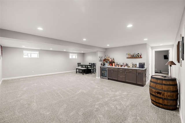 2320 SE Maxwell Dr, Waukee, IA 50263 - indoor bar with wine cooler, recessed lighting, light carpet, and baseboards